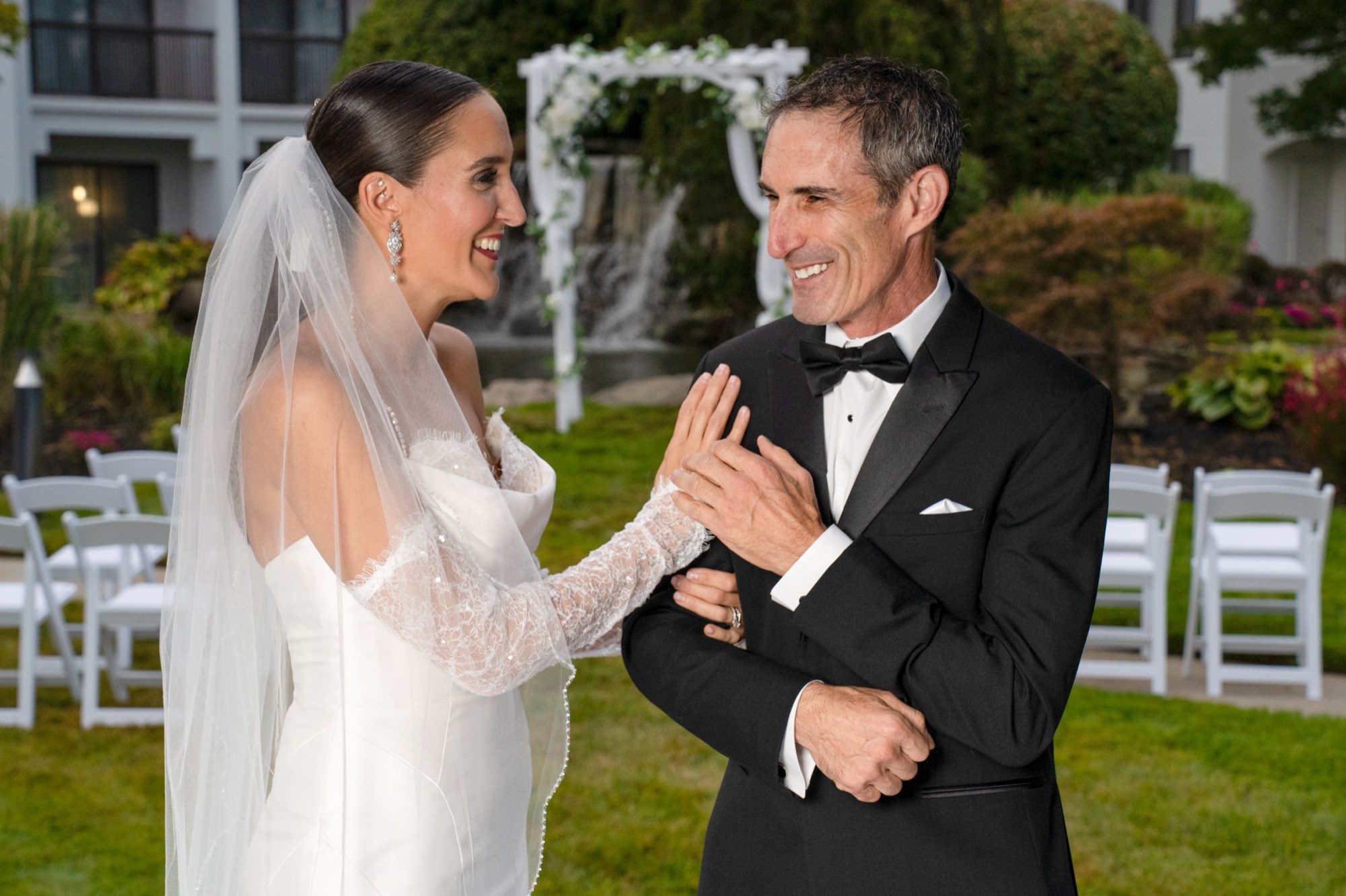 Newlyweds walking together through the courtyard