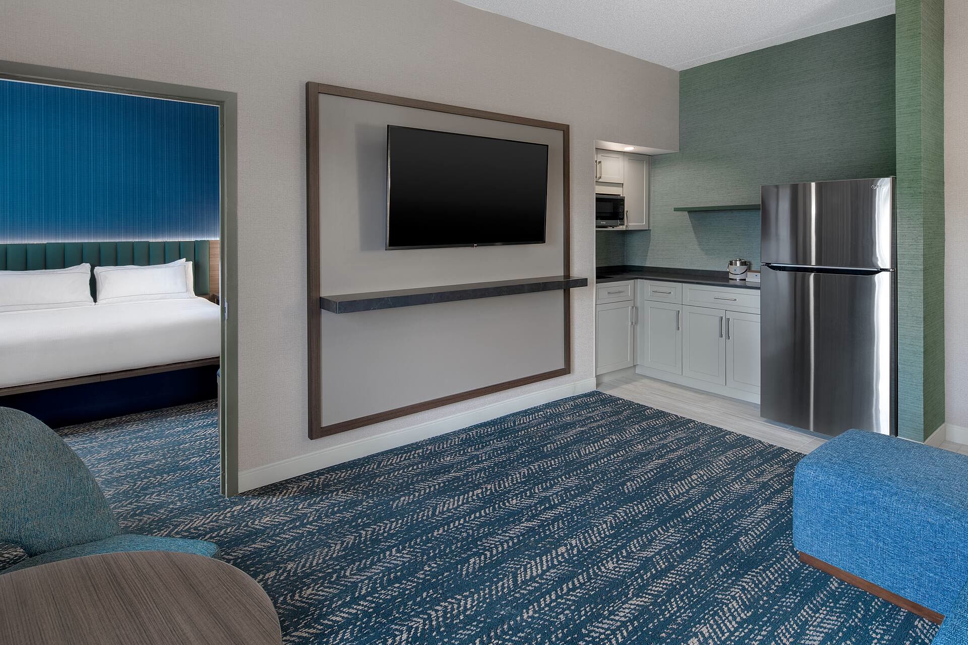 The kitchen area and dining counter inside a two-room suite